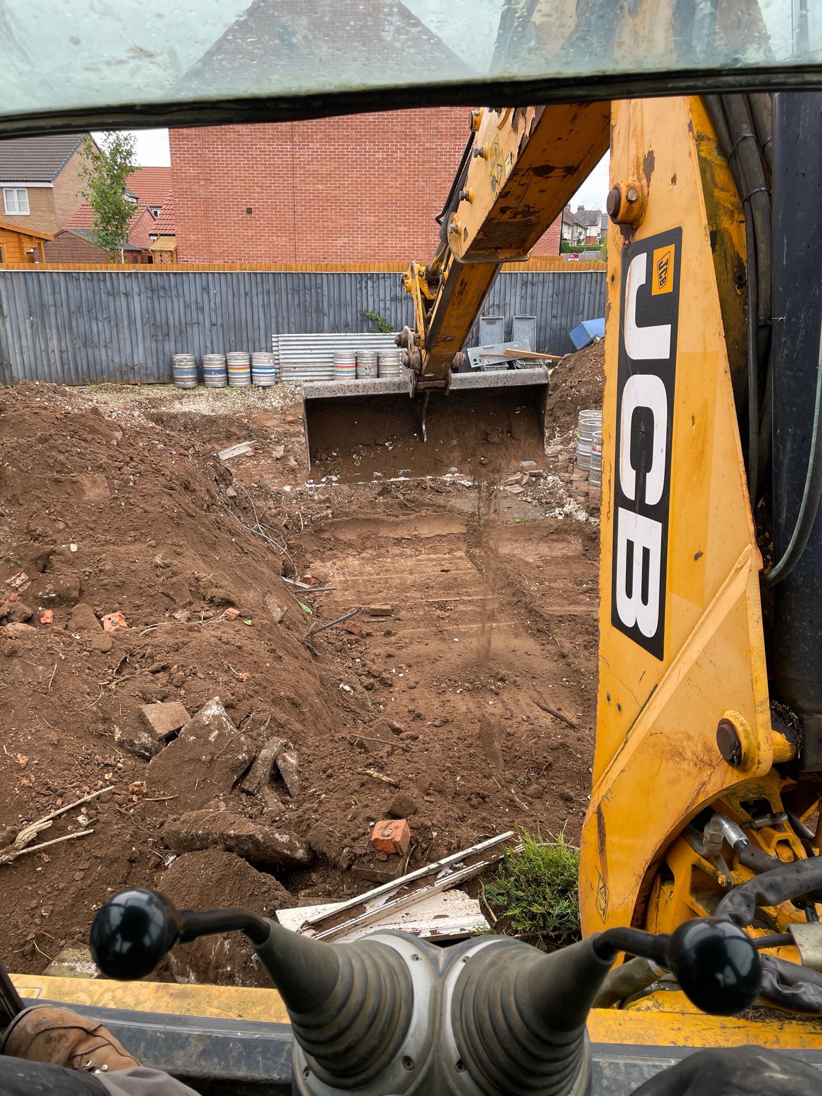 JCB excavation in residential garden