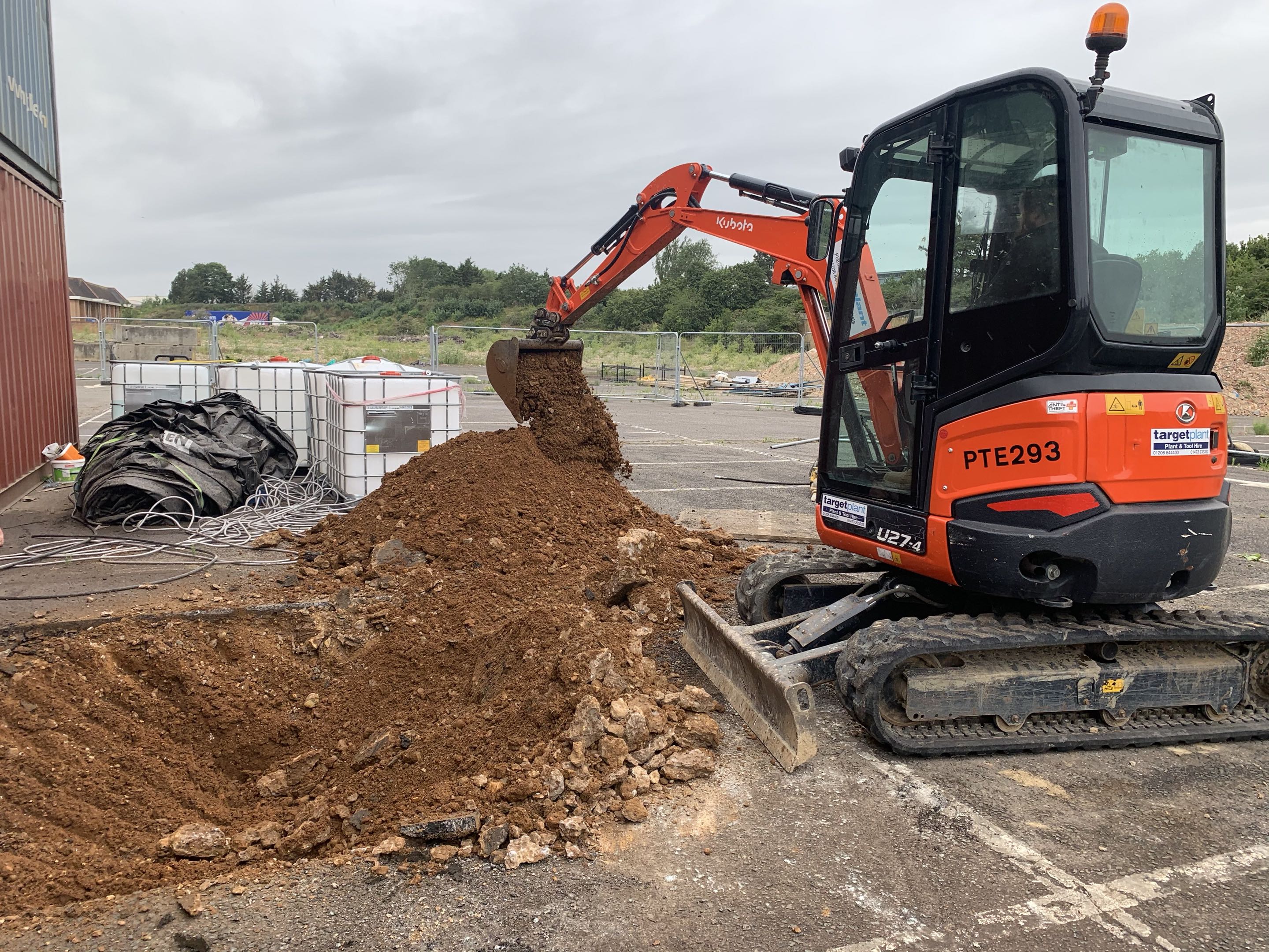 Mini excavator trench digging for services