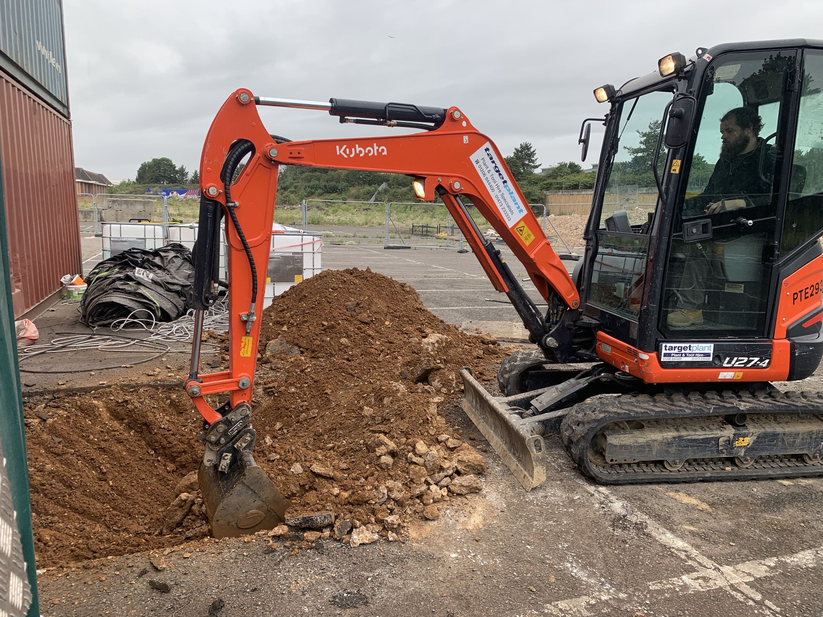 Mini excavator utility trench work